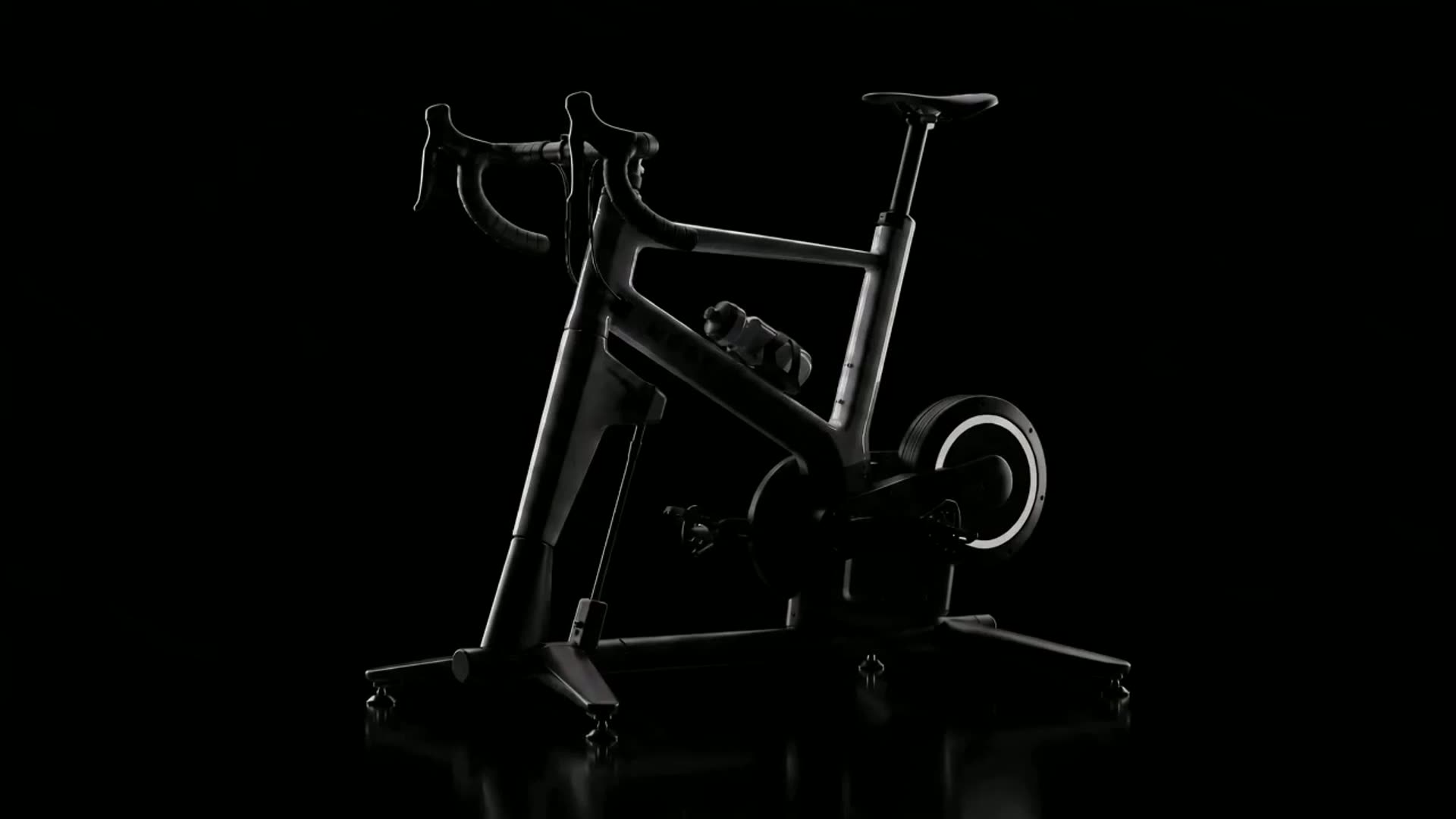 A rider leaning into a turn on a MUOV indoor bike